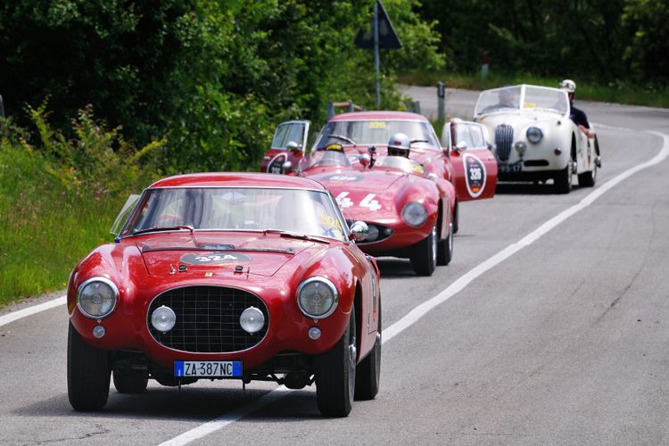 vintage car racing: it will be an experience driving and admiring  the classic Italian landscapes of rolling hills studded with picturesque cypresses